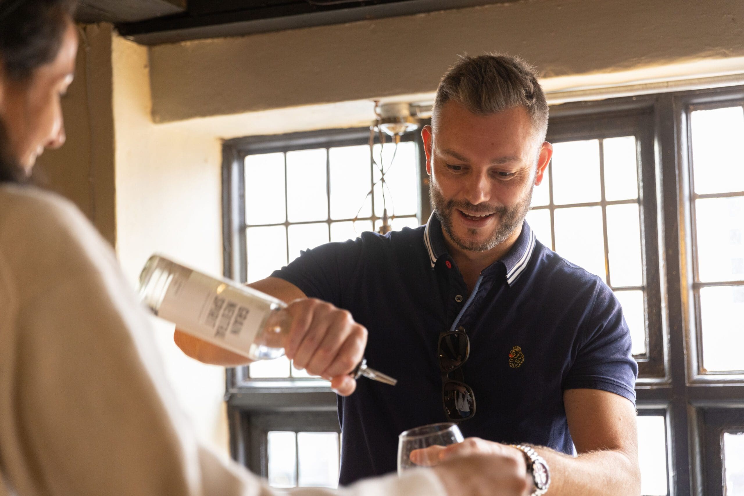 Gentleman pouring spirits